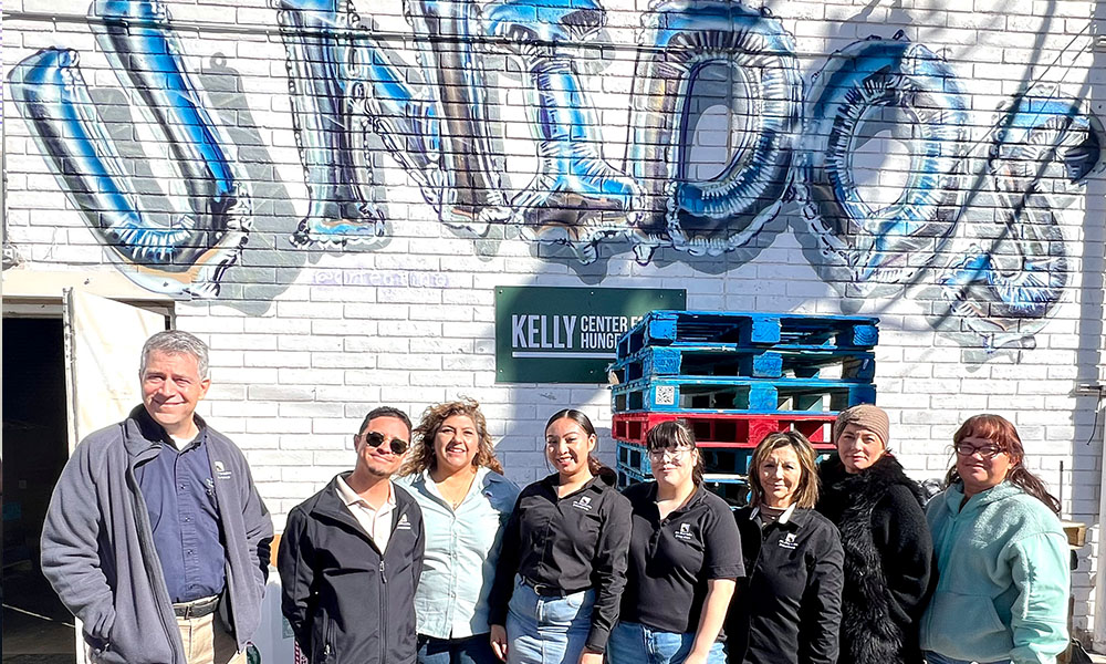 Blog - Team Smiling and Standing for a Photo for their Volunteer Day 2024